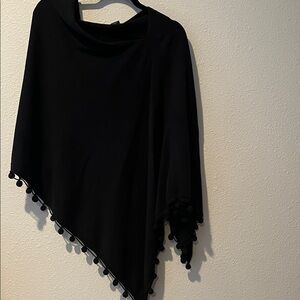 Poncho by Cynthia Rowley Elegant Black with ball fringe
100% Cotton
OS